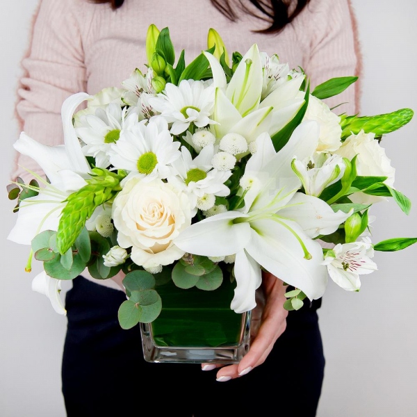 Lilies - 3, White rose 50 cm - 5, Bacardi White Spray Chrysanthemum - 3, Alstromeria white, soft pink - 3, Santini White Spray Chrysanthemum - 2, Transparent vase, Oasis, Ornithogalum, Eucalyptus Cinerea
