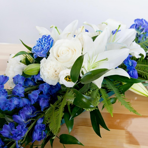 Blue carnation - 4, White rose 50 cm - 6, lisianthus - 5, Lilies - 3, Carnation white, cream - 5, Pot for compositions, Oasis, Blue Delphinium, Ambrella, Ruscus italian, Aspidistra (1 pc.), Skimmia