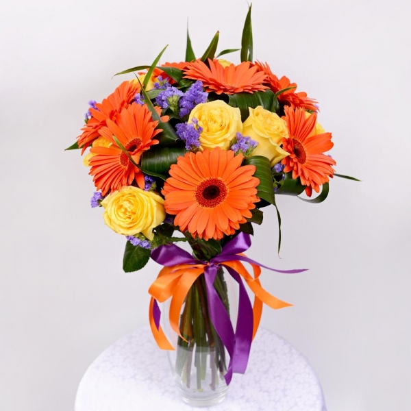 Gerbera daisies - 7, Yellow rose 50 cm - 8, Aspidistra (1 pc.), Blue Statice, Ribbon