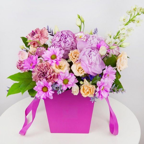 White Delphinium - 1, Spray rose: white, cream, light pink 50 cm - 6, Pink carnation - 4, Pink Lisianthus (Eustoma) - 4, Peony pink - 4, Bacardi Pink Spray Chrysanthemum - 1, Round flower box small , Oasis, Salal, Eucalyptus parvifolia (1 pc.)