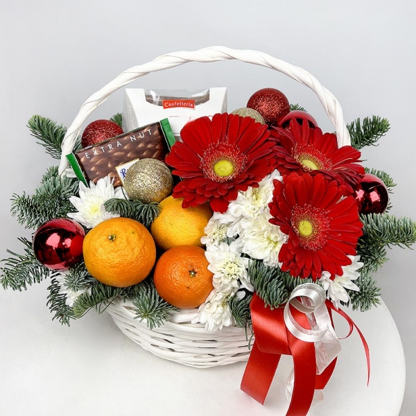 Gerbera red - 3, Baltica White Spray Chrysanthemum - 2, Medium Basket, Spruce branches (1pc.), Oasis, Tangerine, 1 pc., Chocolate Ritter Sport 100g, Box of candies «Raffaello» 150 g, Ribbon, Christmas decor (set)