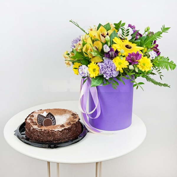 Gerbera yellow - 2, Lilac carnation - 3, Orchid bud yellow/brown Cymbidium - 3, Alstromeria lilac, purple - 2, Bacardi Yellow Spray Chrysanthemum - 3, Alstromeria Yellow, Orange - 1, Purple Lisianthus (Eustoma) - 6, Round flower box small , Film, Oasis, Pistachio, Ruscus, Ambrella, Flask for orchids, Ribbon, Cake in assortment