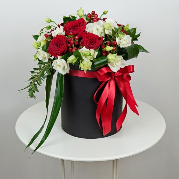 Red rose 50 cm - 9, lisianthus - 5, Round flower box medium, Oasis, Film, Ruscus, Aspidistra (1 pc.), Hypericum, Eucalyptus parvifolia (1 pc.), Ribbon