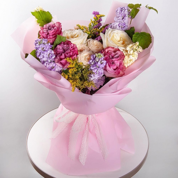 White rose 50 cm Ecuador - 5, Pink rose Country Blues 50 cm - 3, Spray rose: white, cream, light pink 50 cm - 4, Matthiola Lilac - 3, White Matthiola - 2, Pink Statice, Solidago (1 pc.),  Raspberry branch, Wrapping Paper