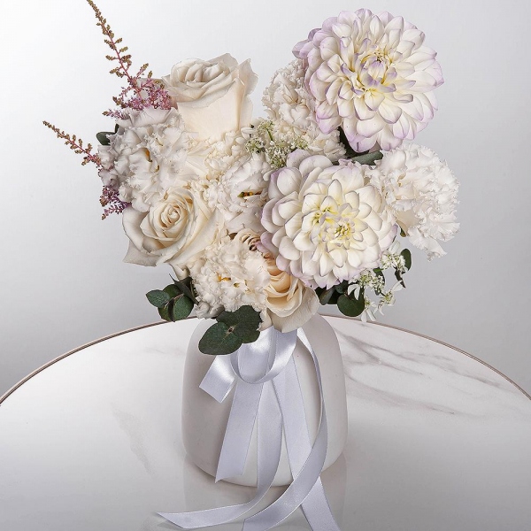 White Dahlia - 2, lisianthus - 3, White rose 50 cm Ecuador - 7, Carnation white, cream - 7, Astilbe, Ozotamnus, Eucalyptus, Ribbon