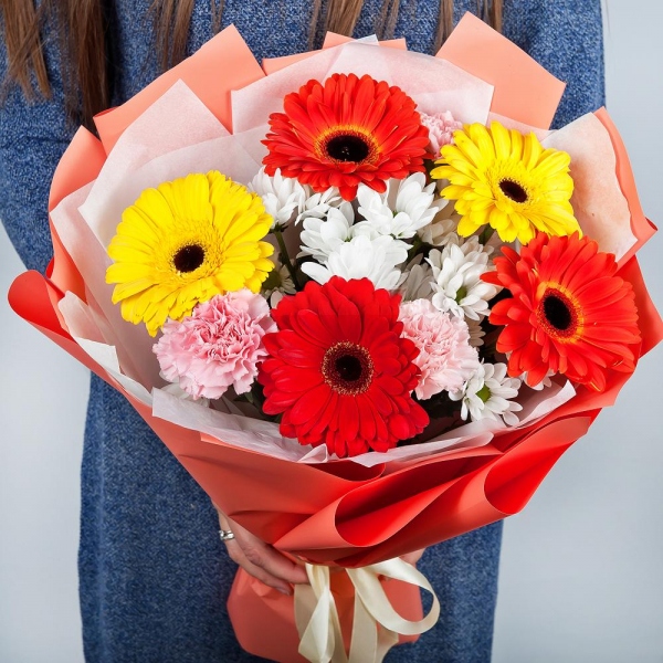 Gerbera daisies - 2, Bacardi White Spray Chrysanthemum - 3, Pink carnation - 3, Gerbera yellow - 2, Gerbera red - 1, Wrapping Paper, Ribbon