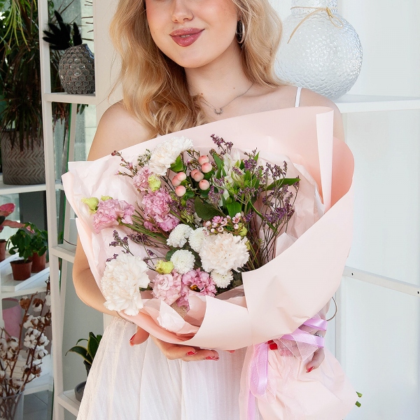 Carnation white, cream - 3, Newton White Spray Chrysanthemum - 1, Alstromeria white, soft pink - 1, Pink Lisianthus (Eustoma) - 2, Hypericum, Limonium (1 pc.), Waxflower (1 pc.), Wrapping Paper