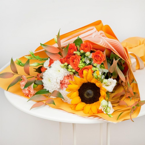 Sunflower - 1, Orange carnation - 2, lisianthus - 3, Baltica White Spray Chrysanthemum - 1, Spray rose: yellow, orange 50 cm - 3, Ruscus italian, Wrapping Paper