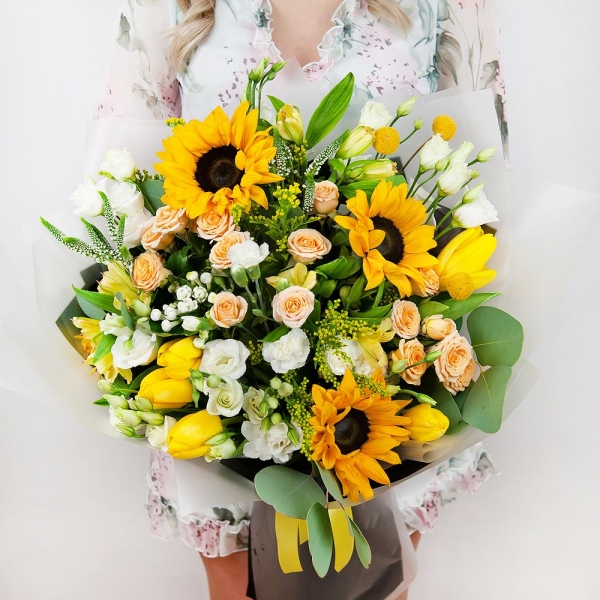 Sunflower - 4, Spray rose: white, cream, light pink 50 cm - 4, lisianthus - 4, Alstromeria Yellow, Orange - 4, Yellow tulip - 7, White spray carnation - 3, Solidago (1 pc.), Veronica spray, Craspedia, Pistachio, Eucalyptus populus (1 pc.),  Bouvardia, Wrapping Paper