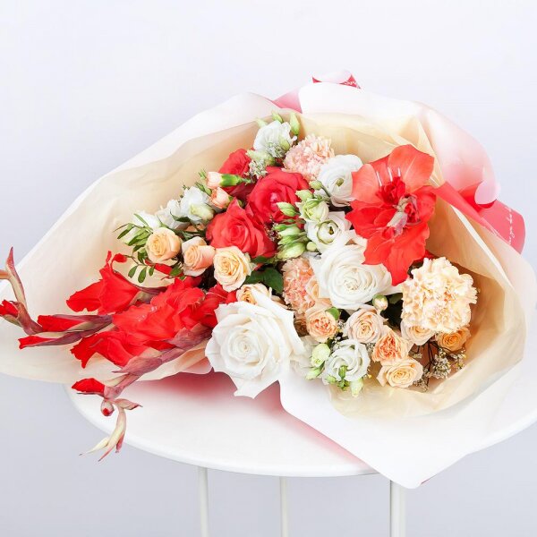 White rose 50 cm - 2, Red rose Nina 50 cm - 3, Spray rose: white, cream, light pink 50 cm - 3, lisianthus - 2, Red Gladiolus - 3, Pink carnation - 3, Limonium (1 pc.), Wrapping Paper