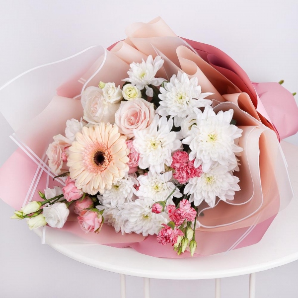 Gerbera pink - 2, Baltica White Spray Chrysanthemum - 3, Spray rose: white, cream, light pink 50 cm - 3, Pink spray carnation - 2, lisianthus - 2, Rose Cream 50 cm - 4, Wrapping Paper
