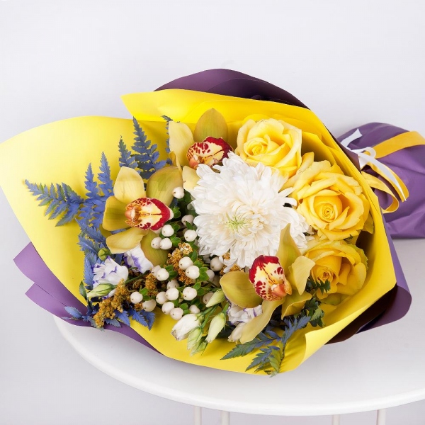 Magnum White Chrysanthemum - 1, Orchid bud yellow/brown Cymbidium - 3, Purple Lisianthus (Eustoma) - 3, Yellow rose 50 cm - 4, Flask for orchids, Hypericum, Solidago (1 pc.), Fern (1 pc.), Wrapping Paper