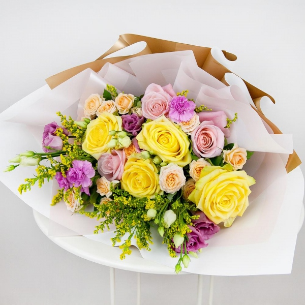 Yellow rose 50 cm - 6, Pink rose 50 cm - 5, Spray rose: white, cream, light pink 50 cm - 5, Pink spray carnation - 4, Pink Lisianthus (Eustoma) - 2, Solidago (1 pc.), Wrapping Paper