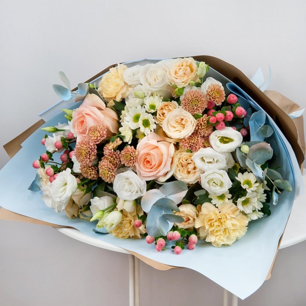 White rose 50 cm - 1, Rose Cream 50 cm - 2, Spray rose: white, cream, light pink 50 cm - 2, lisianthus - 4, Carnation white, cream - 3, Santini White Spray Chrysanthemum - 2, Daisy poms Santini pink, purple - 2, Hypericum, Eucalyptus Cinerea, Wrapping Paper