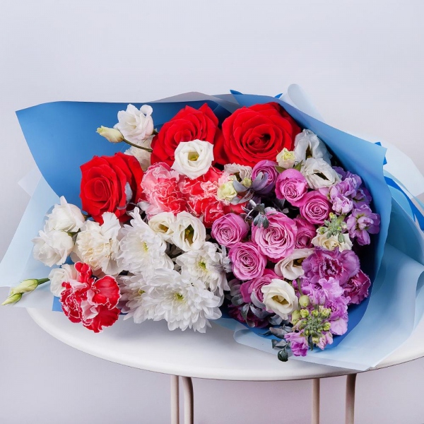 Baltica White Spray Chrysanthemum - 1, Peony sprayrose - 2, Red rose 50 cm - 3, Carnation red - 3, Matthiola Lilac - 2, lisianthus - 2, Carnation spray - 1, Carnation white, cream - 2, Pistachio, Wrapping Paper