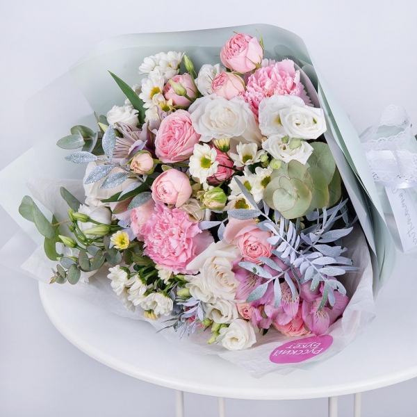 Santini White Spray Chrysanthemum - 3, Alstromeria white, soft pink - 2, Pink carnation - 2, White rose 50 cm - 3, lisianthus - 3, Peony sprayrose - 3, Pistachio, Eucalyptus Cinerea, Wrapping Paper