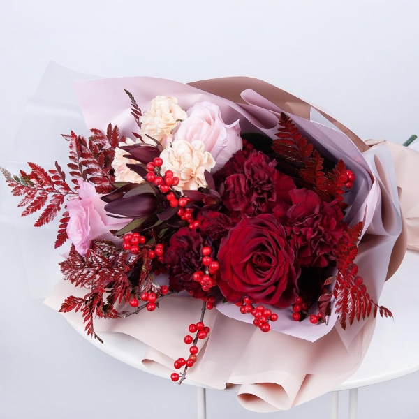 Red rose 50 cm - 2, Pink rose 50 cm - 2, Carnation red - 6, Carnation white, cream - 4, Fern (1 pc.), Ilex, Leukodendron, Wrapping Paper, Ribbon