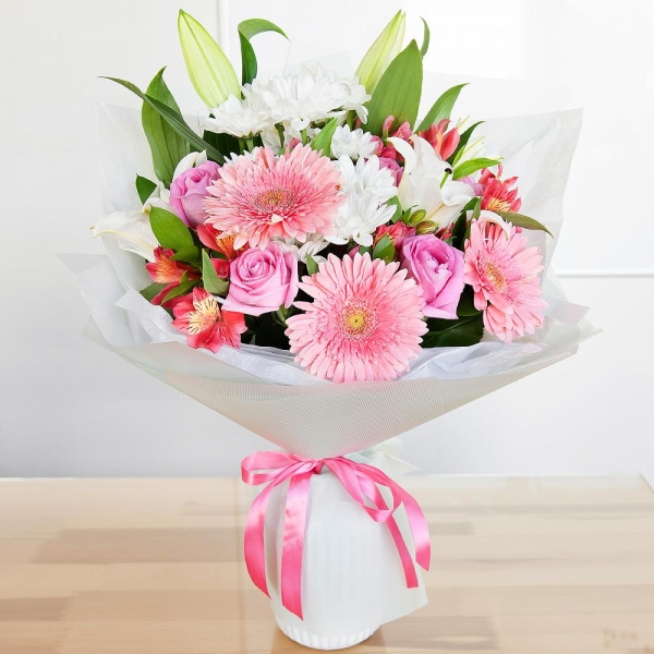 Lilies - 2, Alstromeria Red, Bright Pink - 2, Gerbera pink - 3, Pink rose 50 cm - 5, Bacardi White Spray Chrysanthemum - 2, Pistachio, Ruscus, Wrapping Paper, Ribbon