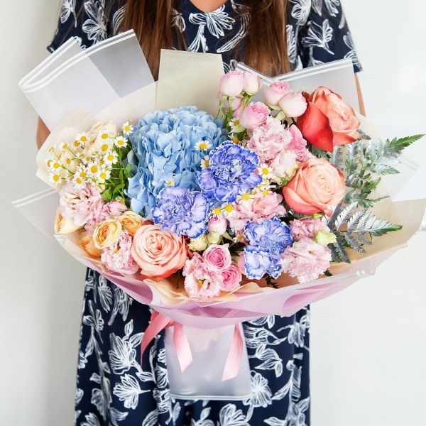 Blue/purple hydrangea - 1, Lilac carnation - 3, Peony rose Kahala 50 cm - 3, Spray rose: white, cream, light pink 50 cm - 4, Chamomile - 2, Pink Lisianthus (Eustoma) - 2, Fern (1 pc.), Wrapping Paper