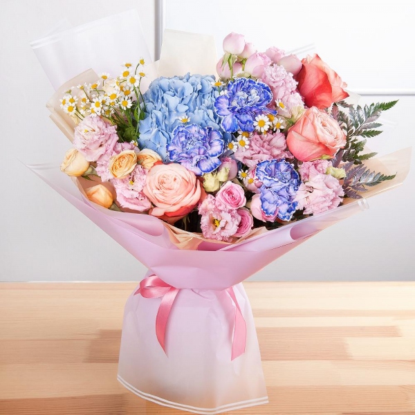 Blue/purple hydrangea - 1, Lilac carnation - 3, Peony rose Kahala 50 cm - 3, Spray rose: white, cream, light pink 50 cm - 4, Chamomile - 2, Pink Lisianthus (Eustoma) - 2, Fern (1 pc.), Wrapping Paper