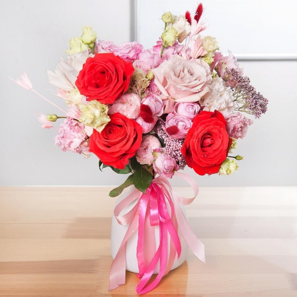 Red rose Nina 50 cm - 3, Pink rose 50 cm - 2, Rose Powder 50 cm Ecuador (Quicksand, Menta) - 2, Carnation white, cream - 2, Bright pink spray rose mix, 50 cm - 1, Peony sprayrose - 2, Pink Lisianthus (Eustoma) - 2, Ozotamnus, Dried flowers in assortment, Ribbon