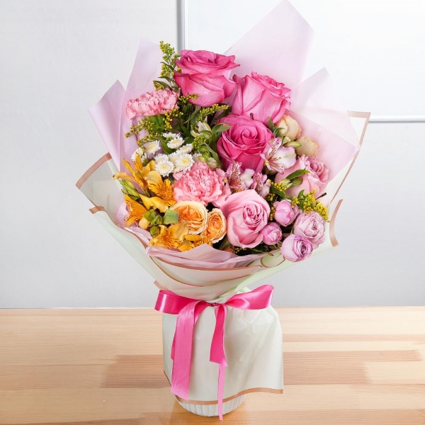 Pink rose 50 cm - 6, Spray rose: white, cream, light pink 50 cm - 2, Peony sprayrose - 1, Athos poms Stallion - 3, Pink carnation - 3, Alstromeria Yellow, Orange - 2, Alstromeria white, soft pink - 1, Solidago (1 pc.), Wrapping Paper