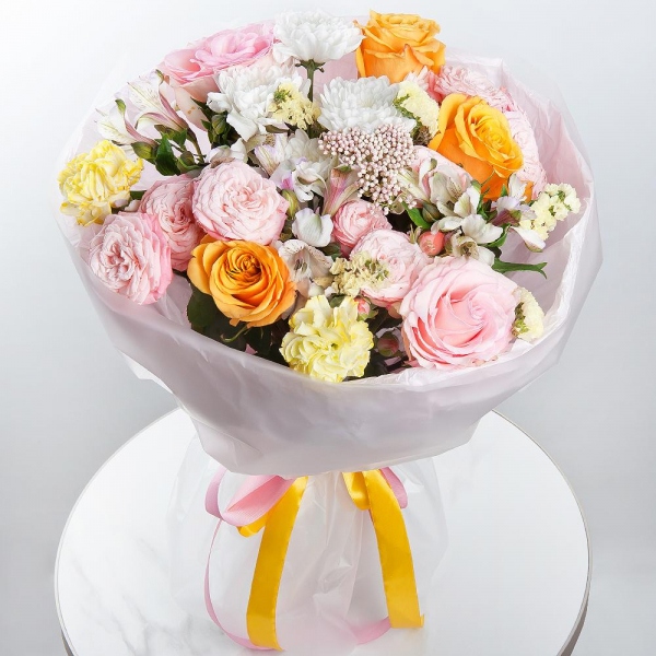 Yellow rose 50 cm - 3, Pink rose 50 cm - 2, Baltica White Spray Chrysanthemum - 1, Peony sprayrose - 3, Alstromeria white, soft pink - 3, Yellow carnation - 2, Yellow Statice, Ozotamnus, Wrapping Paper
