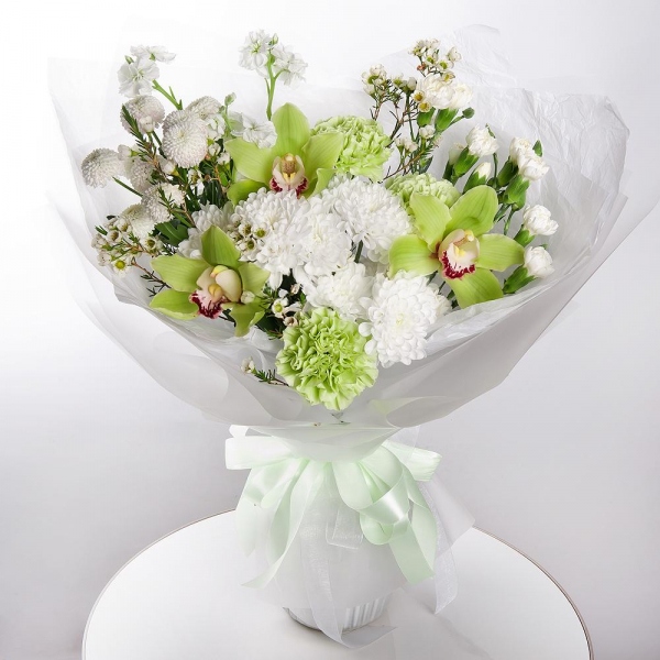 Green Cymbidium Orchid Bud - 3, Baltica White Spray Chrysanthemum - 2, Green carnation - 5, White spray carnation - 5, White Matthiola - 2, Athos poms Stallion - 1, Flask for orchids, Waxflower (1 pc.), Wrapping Paper