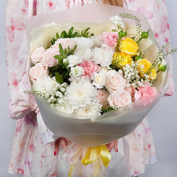 Baltica White Spray Chrysanthemum - 2, Peony sprayrose - 2, Pink carnation - 3, White spray carnation - 2, White Matthiola - 2, Gypsophila - 1, Spray rose: yellow, orange 50 cm - 1, Pistachio, Green bell (1 pc.), Wrapping Paper