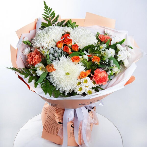 Magnum White Chrysanthemum - 3, Santini White Spray Chrysanthemum - 4, Spray rose: yellow, orange 50 cm - 3, Orange carnation - 3, White spray carnation - 3, Alstromeria white, soft pink - 3, Fern (1 pc.), Pistachio, Brunia Green Lanuginosa (1 pc.), Veronica spray, Wrapping Paper