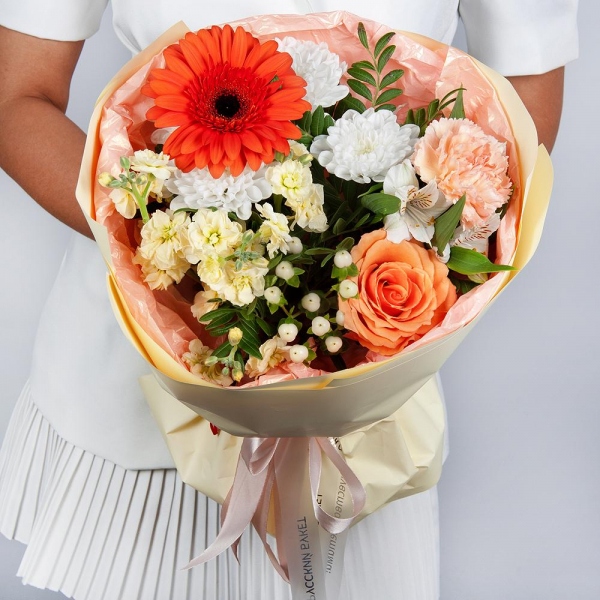 Gerbera daisies - 1, Baltica White Spray Chrysanthemum - 1, White Matthiola - 1, Alstromeria white, soft pink - 3, Pink carnation - 2, Rose Cream 50 cm - 1, Hypericum, Pistachio, Wrapping Paper