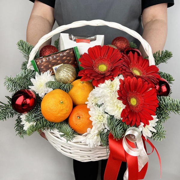 Gerbera red - 3, Baltica White Spray Chrysanthemum - 2, Medium Basket, Spruce branches (1pc.), Oasis, Tangerine, 1 pc., Chocolate Ritter Sport 100g, Box of candies «Raffaello» 150 g, Ribbon, Christmas decor (set)